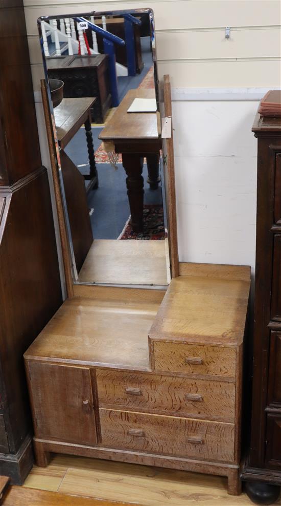 A Heals limed oak dressing table W.76cm